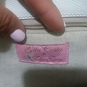 Gita Costa Tote bags